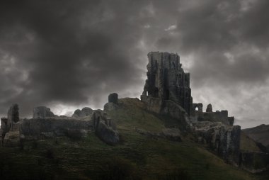 Storm above castle ruins clipart