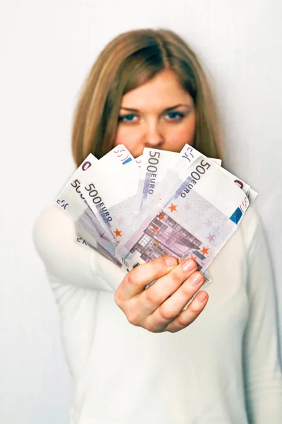 Mulher com dinheiro no fundo branco — Fotografia de Stock