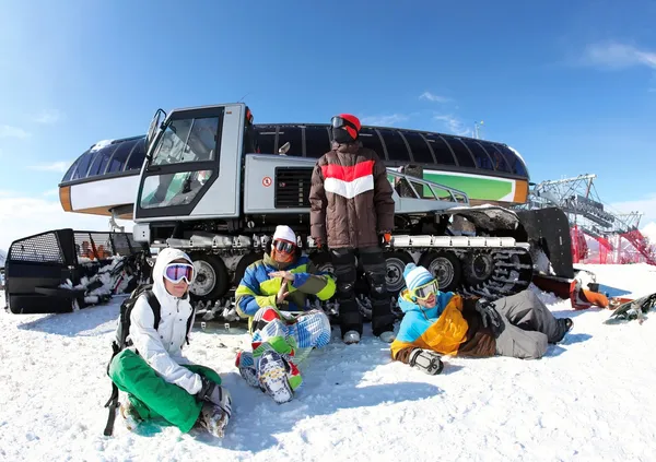 Friends snowboarding on a mountain top - Stock Image - Everypixel