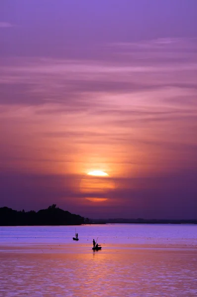 African fishermen at sunset — Stock Photo, Image