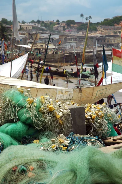Fishing nets and boats on Cape Coast foreshore — Stock Photo, Image