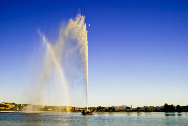 stock image Fountain, Rainbow and half moon