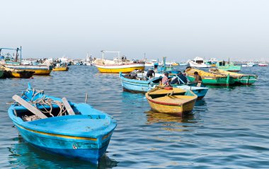 Egyptian fishermen at Eastern harbor of Alexandria city clipart