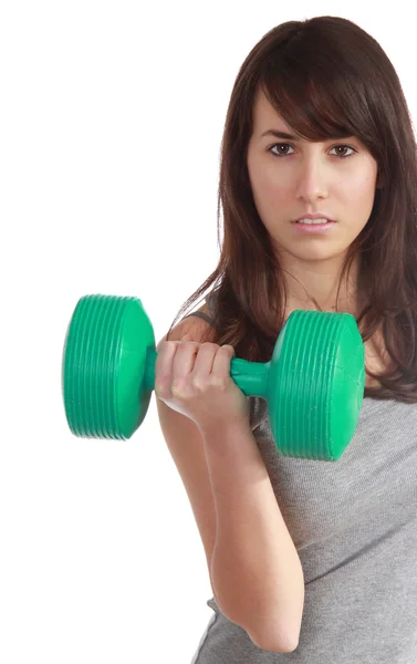 Young attractive girl lift a weight with determination — Stock Photo, Image