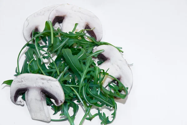 Arugula salad with four slices of mushroom — Stock Photo, Image