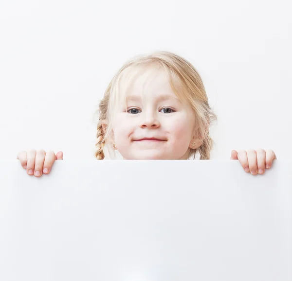 Kind achter wit bord Stockfoto