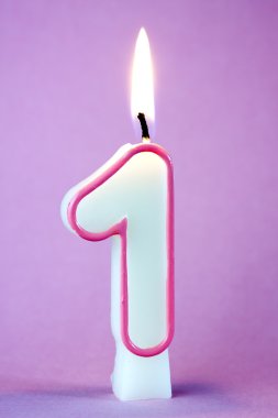 A number 1 candle lit against clipart