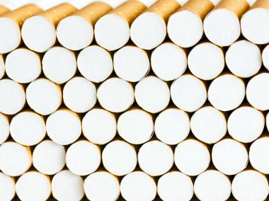 Closeup of a pile of cigarettes clipart