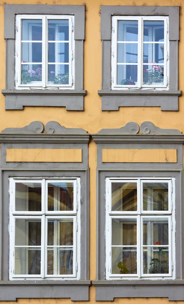 stock image Windows in old yellow wall