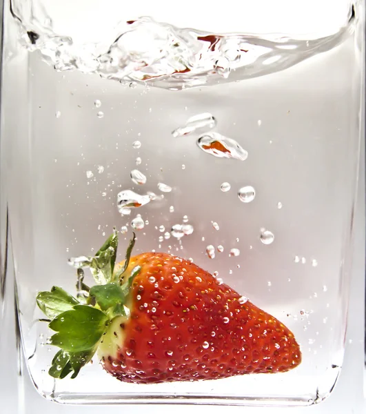 stock image Strawberry falls under water