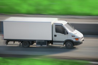 Truck moves on road clipart