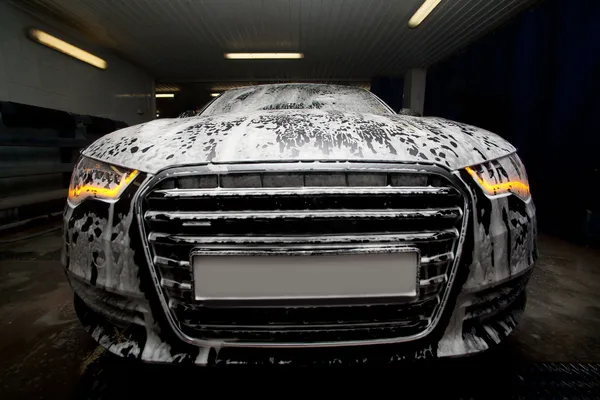 Car in foam on sink — Stock Photo, Image