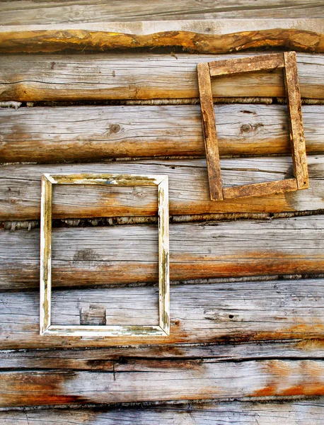 Dos marcos de madera en una antigua pared de madera — Foto de Stock