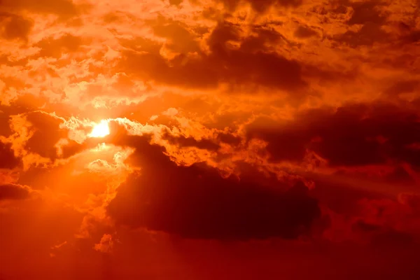 stock image Sunset in the red cloudy sky