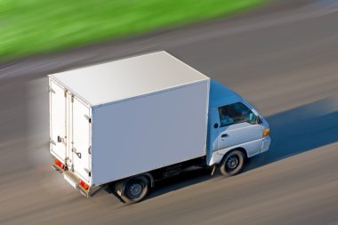 Truck moves on road clipart