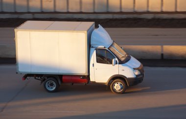 Truck moves on road clipart