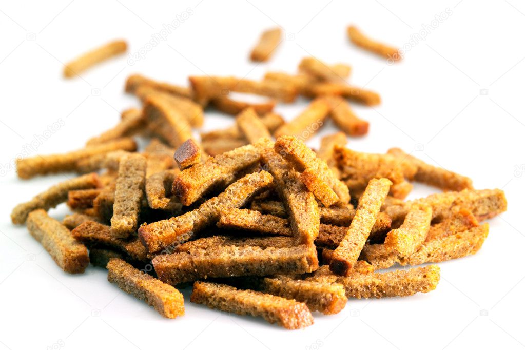 Many small salty dried rusks isolated on white