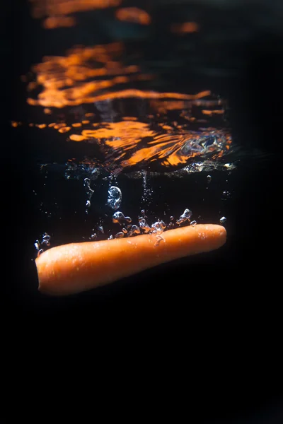 Carrot splashing — Stock Photo, Image