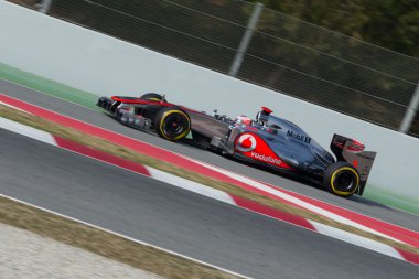 Jenson Button (GBR) McLaren MP4-27 join pit-line - 3th Testing d clipart
