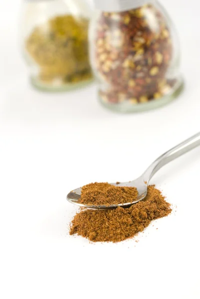 Silver spoon with chili powder — Stock Photo, Image
