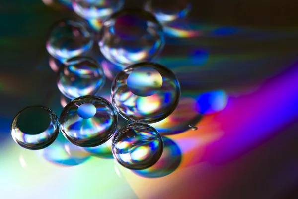 Gotas de agua en un cd — Foto de Stock
