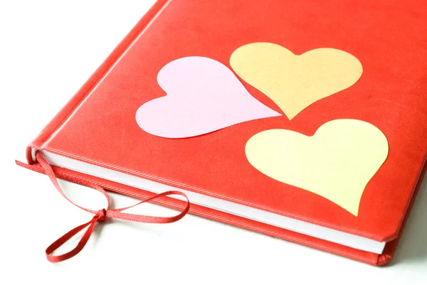 Tre hjärtan på en dagbok — Stockfoto
