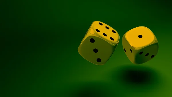 Gold dice at green background — Stock Photo, Image