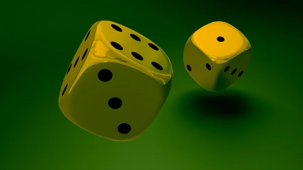 Gold dice at green background closeup — Stock Photo, Image