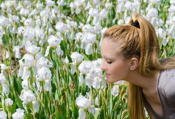 Smelling Iris Flowers — Stock Photo, Image