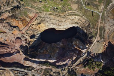 Aerial view above copper open pit clipart