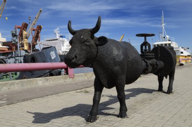 The cow Petroleum at Ventspils - Latvia clipart