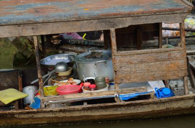 Cooking boat at Vietnamese floating market clipart