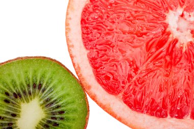 Macro shot of a red grapefruit and a kiwi isolated on white clipart