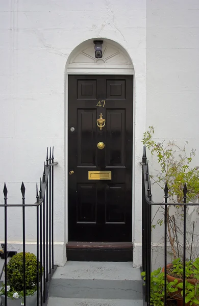 Black front door — Stock Photo, Image