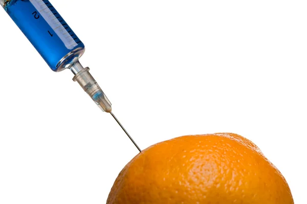 Skleněná injekční stříkačka a oranžové — Stock fotografie