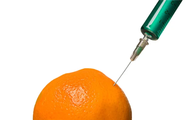 Glazen injectiespuit en oranje — Stockfoto