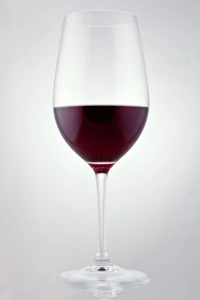 Glass of red wine in soft white light — Stock Photo, Image