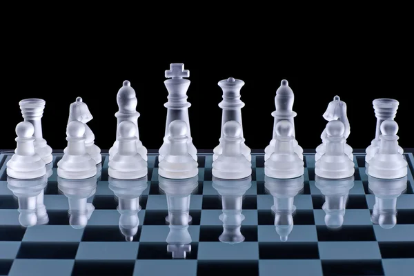 Macro shot of glass chess set against a black background — Stock Photo, Image