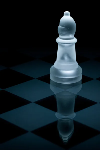 Macro shot of glass chess bishop against a black background — Stock Photo, Image