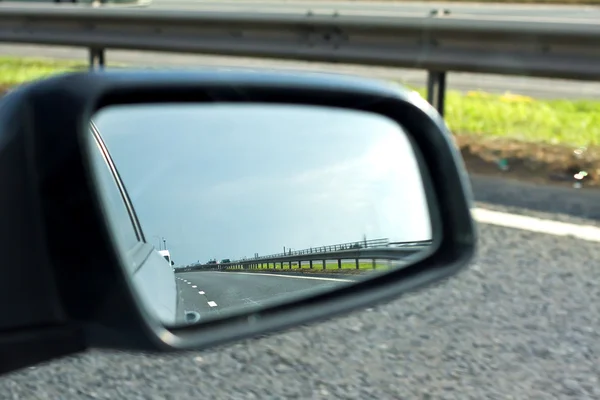 Offiside mirror on a fast moving car — Stock Photo, Image