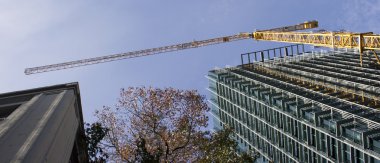 Construction Crane with Buildings clipart