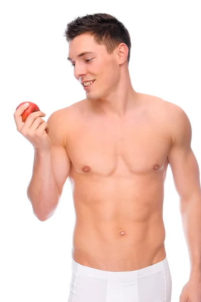 Ung man med äpple — Stockfoto