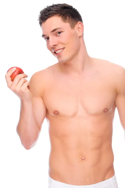 Молодой человек с яблоком — стоковое фото