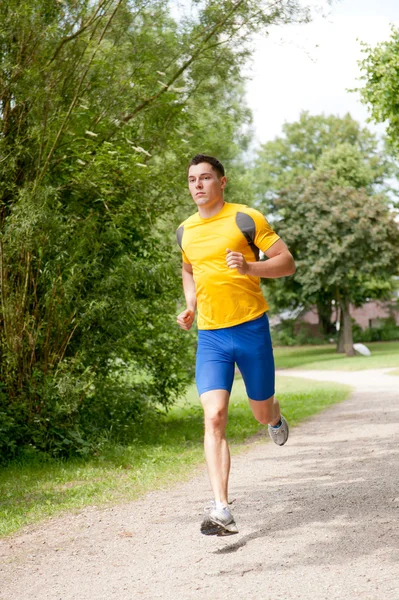 Jonge en gelukkig jogger — Stockfoto