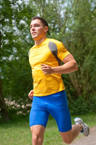 Jonge en gelukkig jogger — Stockfoto