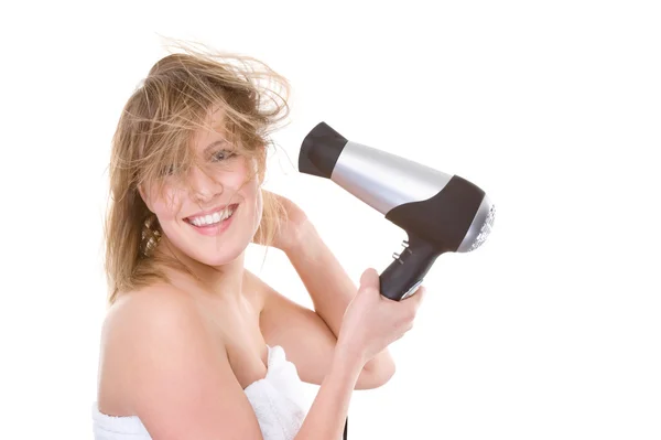 Kadın saç kurutma makinesi ile — Stok fotoğraf