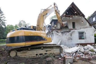 Digger demolishing house clipart