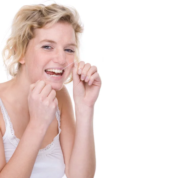 Woman with dental floss — Stock Photo, Image