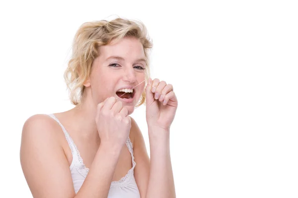 Mujer con hilo dental — Foto de Stock