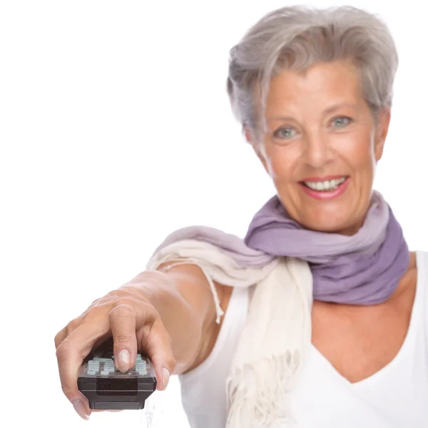 Woman with remote control — Stock Photo, Image